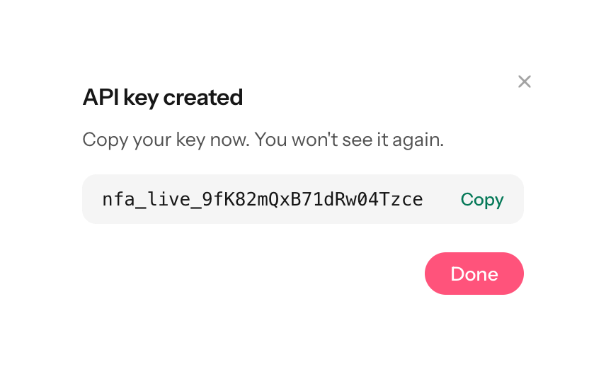 API key created dialog showing a Bearer key starting with nfa_ and a copy button